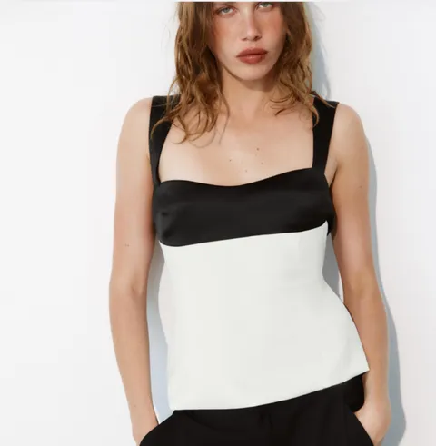 A black and white Zara top with tie-back detail